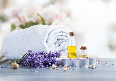 spa massage setting, lavender product, oil on wooden